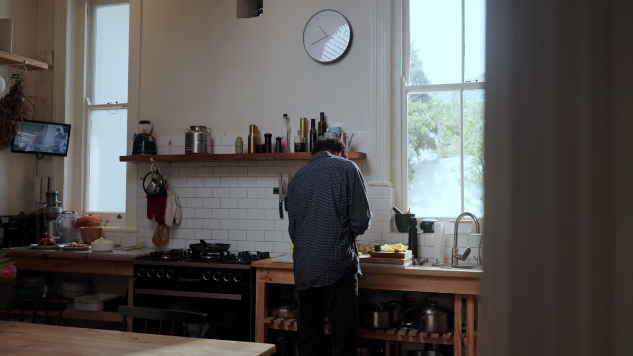 Man Cooking in Bright Kitchen