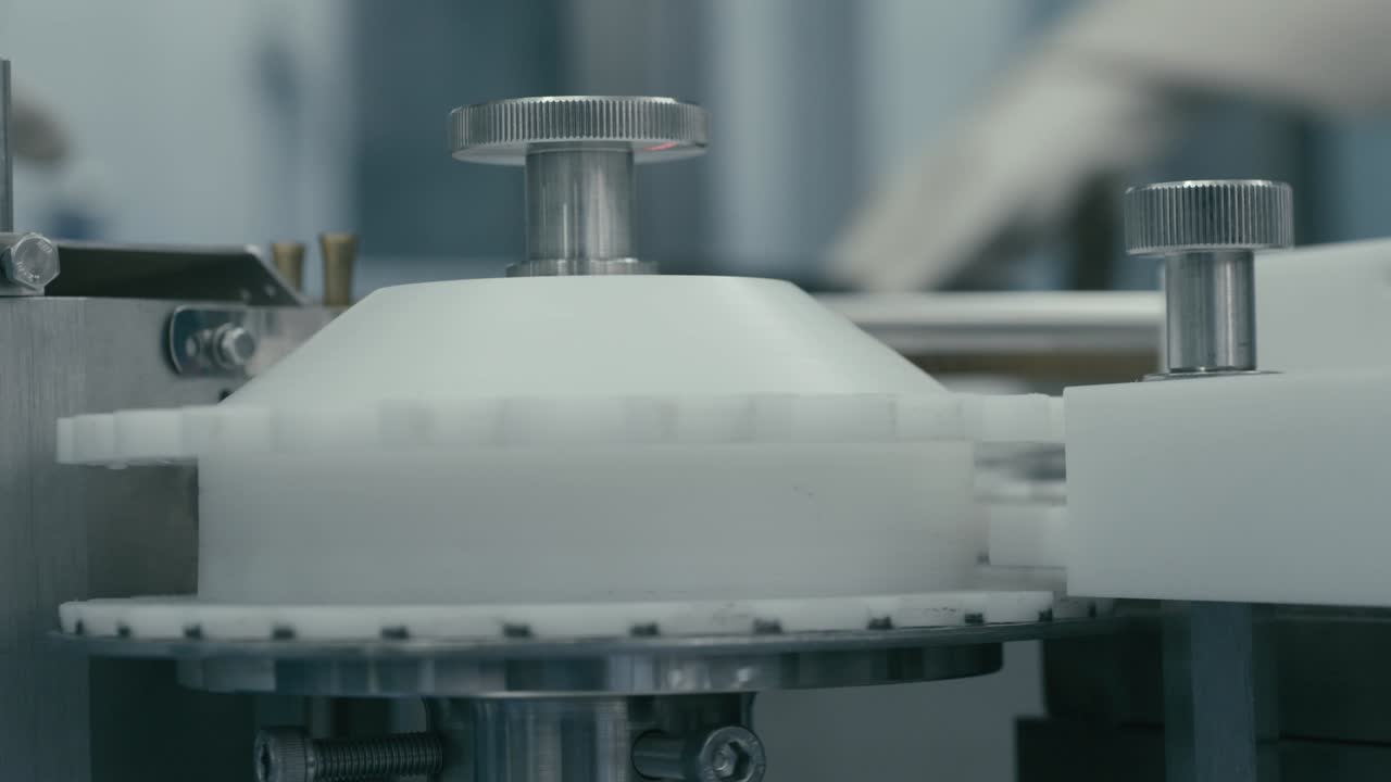 close view of Machine rotating test tubes in circles in the pharmaceutical industry.