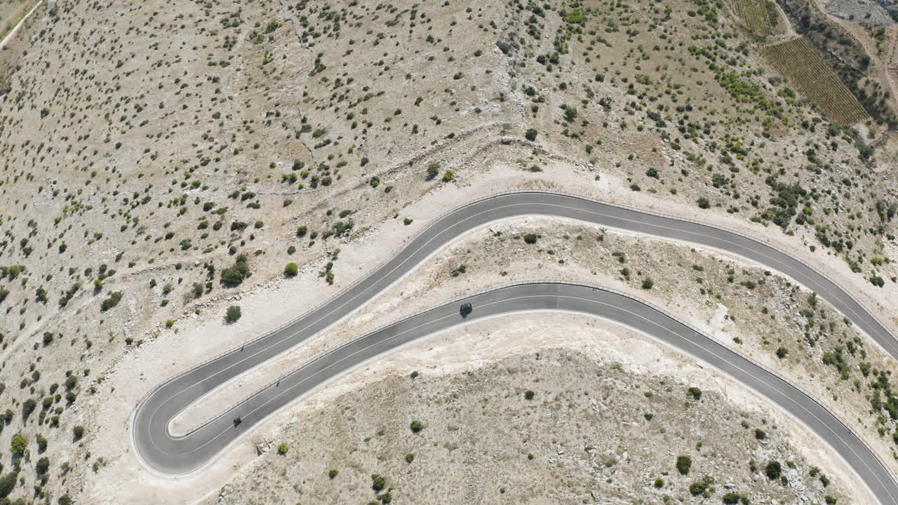 High Angle Aerial of Dune Buggies Driving on Wide Road in Croatia, Brač Island