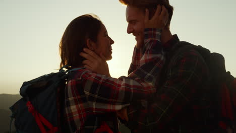 woman and man touching each other face