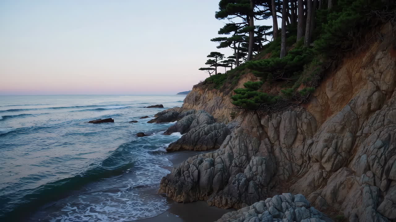 Coastal Cliff with Pine Trees and Waves at Sunrise/Sunset
