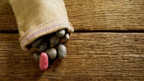 sweet potatoes spilling out from a sack 4k