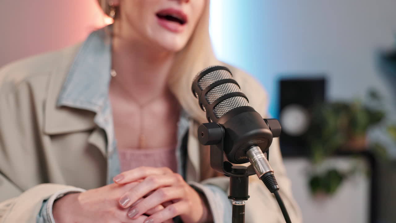 Podcast recording with a woman speaking into a microphone