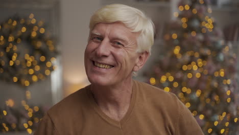 portrait of old happy man looking at the camera