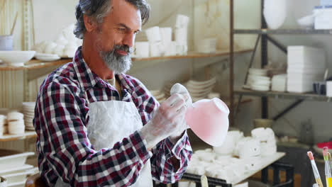 male potter designing ceramic bowl 4k