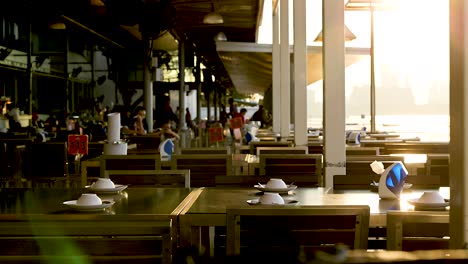 empty tables at a beachside restaurant