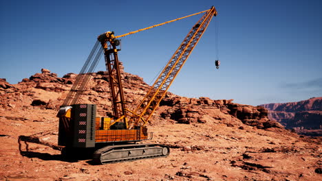 large orange crane in a desert canyon