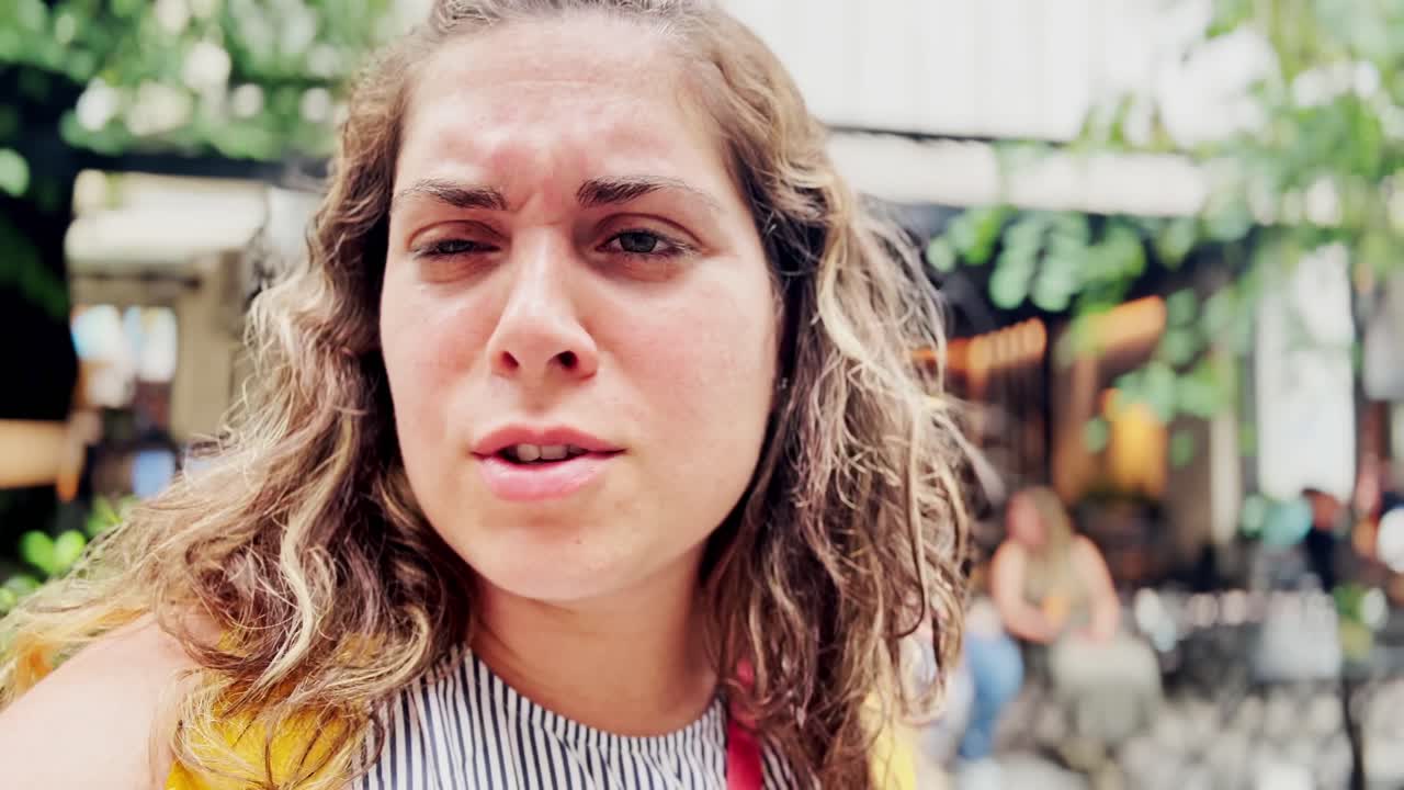 Vlogger Woman Looking Up at Athenian Architecture in Summer