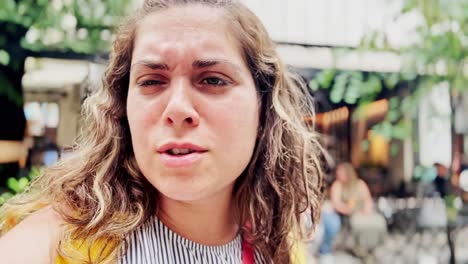 vlogger woman looking up at athenian architecture in summer