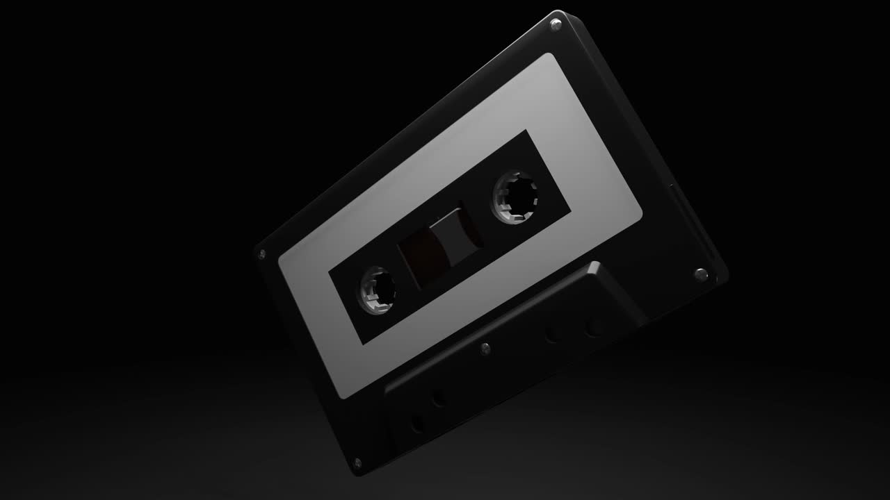 cinta de cassette negra aislada sobre un fondo negro.