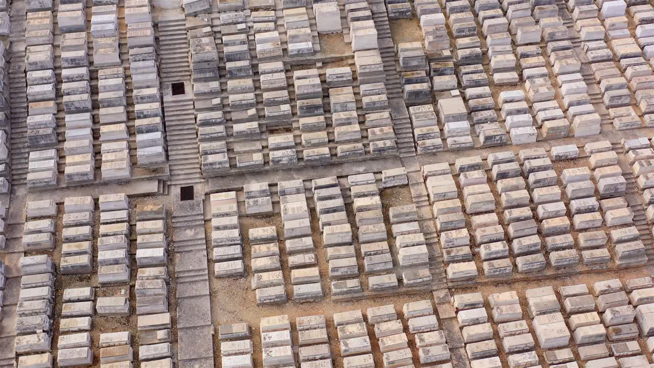 Aerial view of a large cemetery with countless tombstones