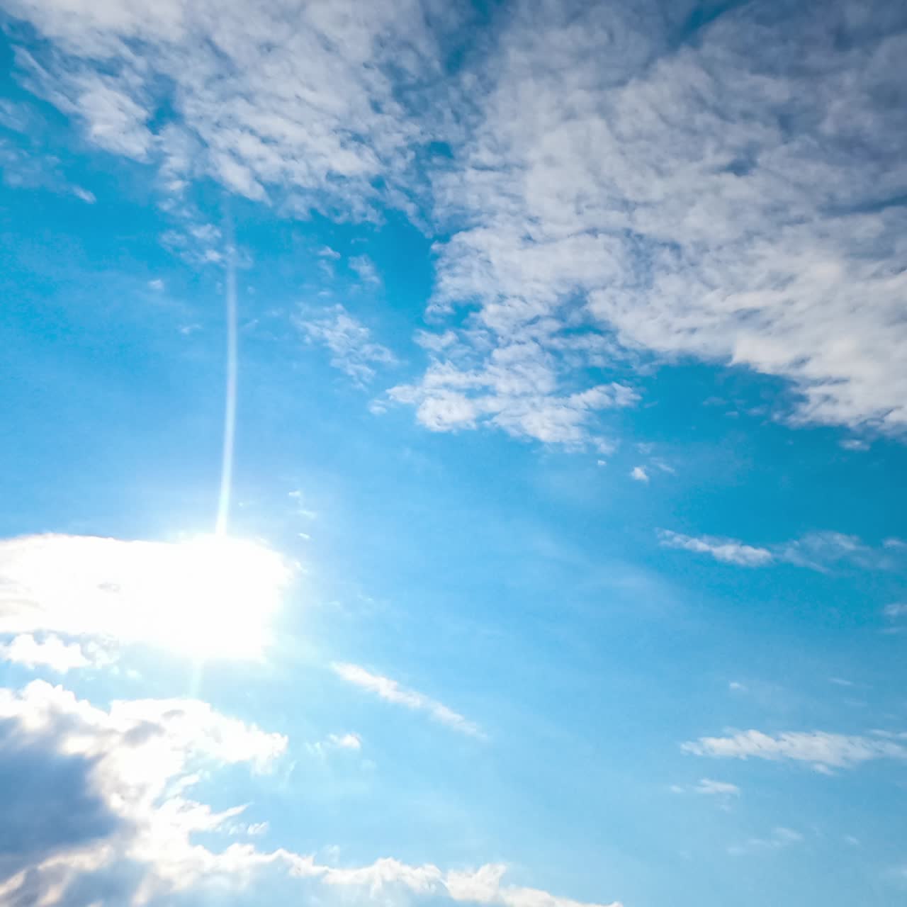 Heavy grey clouds accumulating quickly. Sun appears in the blue sky for some period. Timelapse