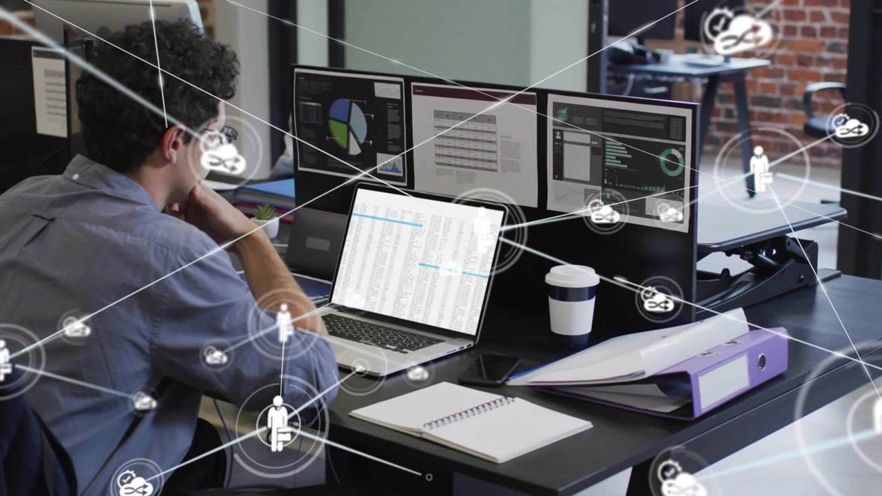 Male analyst typing laptop, sparking animated web linking monitors, cloud icons for IT insights