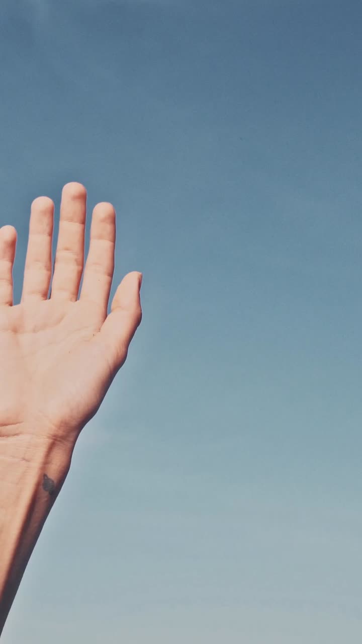 People vote by raising hands up on sky background making informed choice