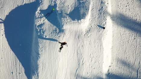 drone filming a snowboarder jumping filmed by a drone, ax les thermes bonascre