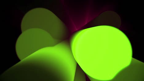 primer plano del movimiento de formas cilíndricas borrosas abstractas con iluminación. fondo negro