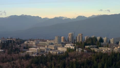 comprehensive college and main campus of simon fraser university over the greenery of burnaby highland in canada