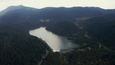 Aerial-Birds-Eye-View-of-Iturbide-Reservoir-Surrounded-by-Misty-Forest-in-Mexico