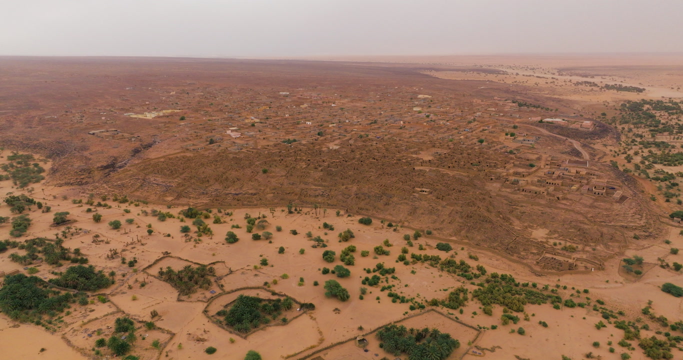 Aerial View Of Historic Desert Town Of Ouadane In Adrar Plateau Of Mauritania At Sunrise.