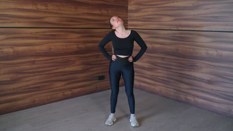 woman doing stretching exercise at home