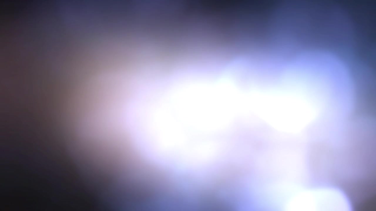 Sfondo astratto con perdite di luce blu e viola e bagliori dell'obiettivo