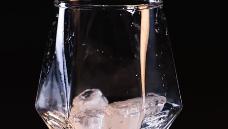 pouring a drink with ice
