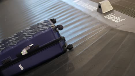 suitcases on baggage carousel at istanbul airport