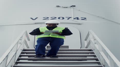 technician working at a wind turbine