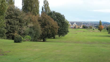 slow pan of golf course hole fairway left to right.