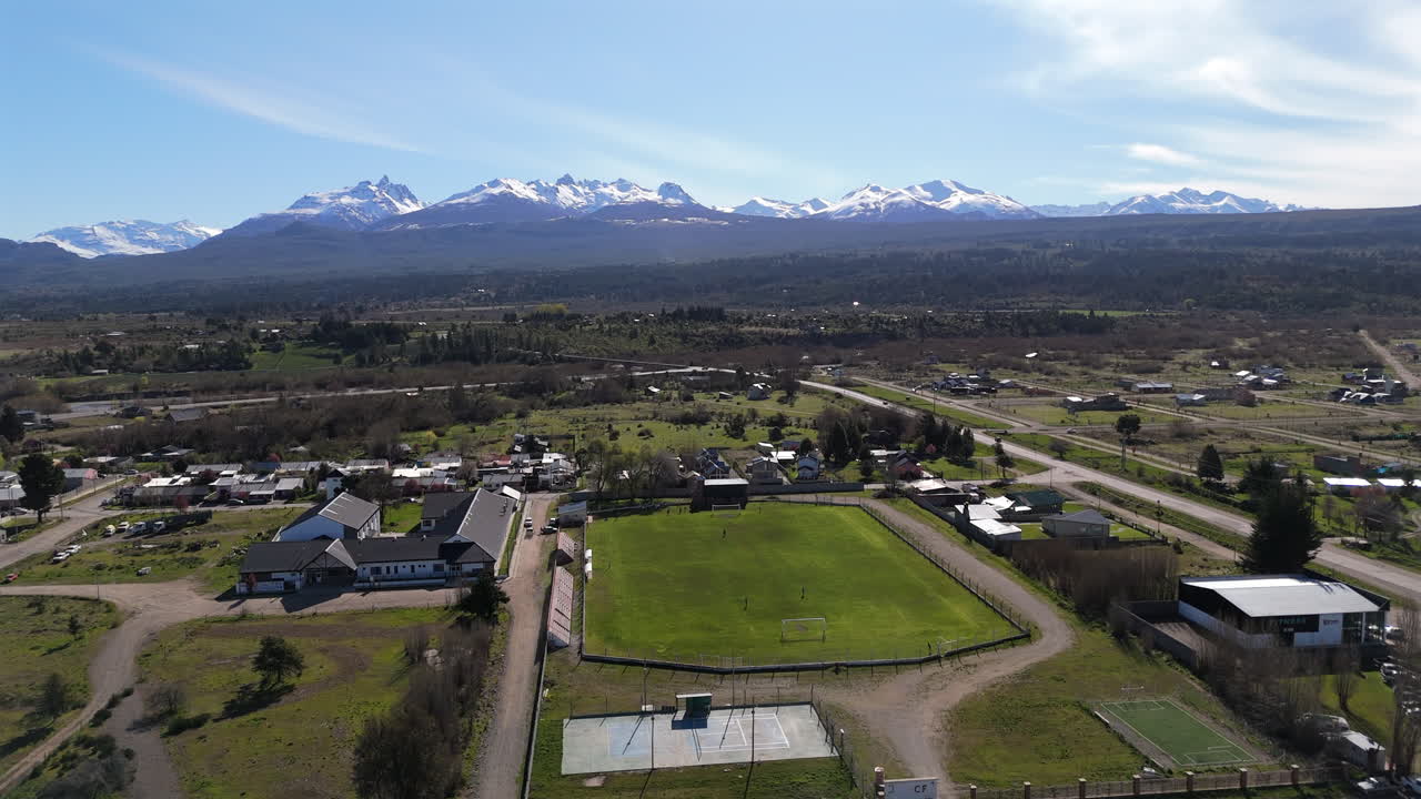 Aerial View of El Jardín Football Field and Scenic Landscape in Chubut Province, Argentina.
