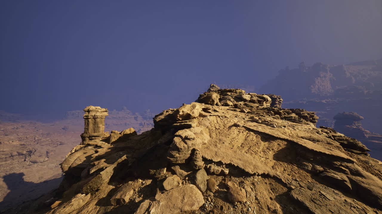 View from a rocky outcrop at sunrise over a desert landscape
