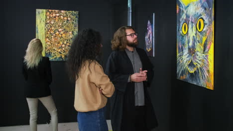 people viewing abstract art at an exhibition