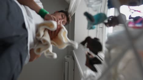 person drying clothes