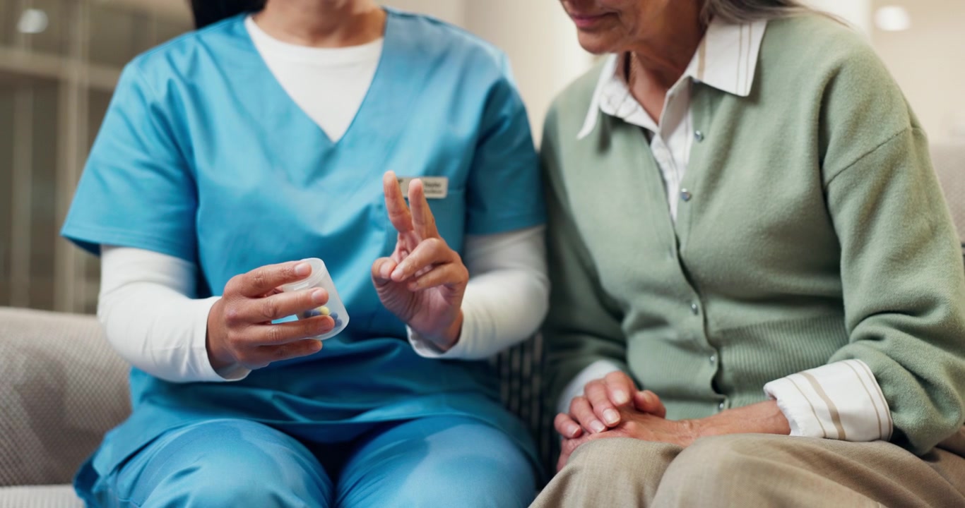 Nurse Explaining Medication Dosage to Senior Patient
