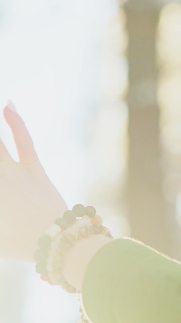 Woman's Hand with Bracelet in Nature