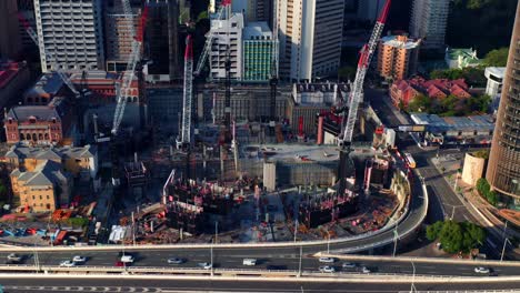 aerial view of the tower cranes at construction site of queen's wharf in 2020, in brisbane city, qld, australia