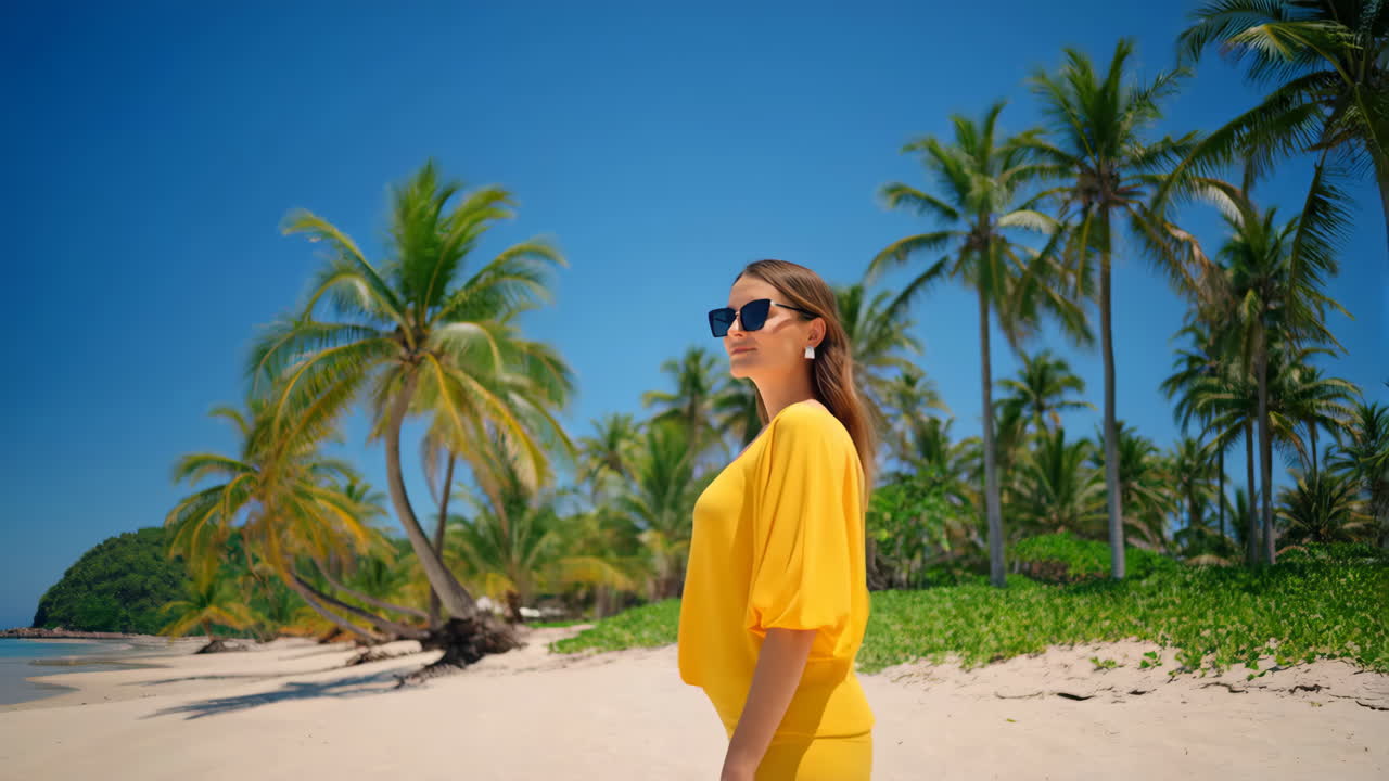 Woman on a Tropical Beach with Palm Trees