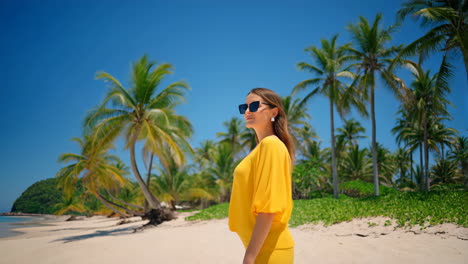 woman on a tropical beach with palm trees