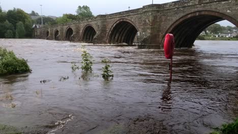 the river dee in spate at the old bridge of dee in aberdeen