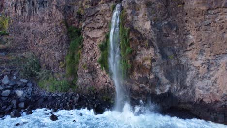 Beautiful-Waterfall-on-Rocky-Island-Coastal-Cliff-of-Madeira,-Portugal---Aerial-with-No-People