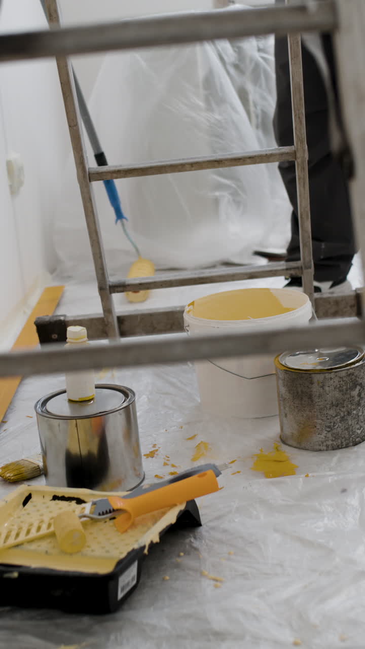 Painter on a Ladder During Home Renovation