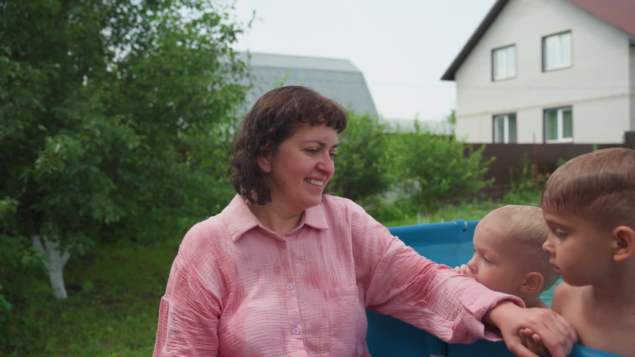 Surprised Woman Laughs During Family Pool Fun, Happy Girl Surprises Woman With Water Splash At Suburban Pool, Caucasian Woman Reacts With Joy As Playful Splash Startles Her At Neighborhood Pool