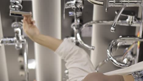 woman shopping for plumbing fixtures