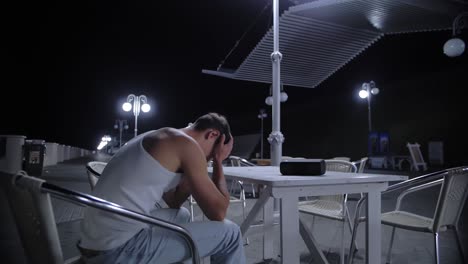 Lonely Man Sitting Alone at Night Cafe