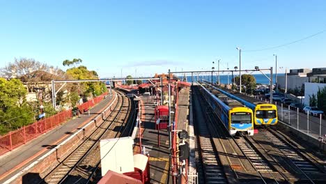 train moving along tracks in sunny brighton beach