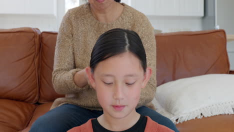 Mother,-Asian-girl-and-brush-hair-for-childcare