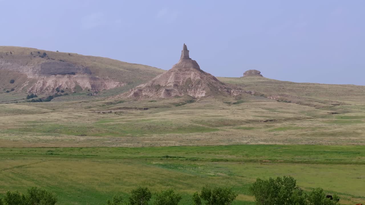 Scenic view of Chimney Rock with vast plains and peaceful nature