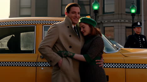 a couple embracing beside a vintage yellow taxi on a city street