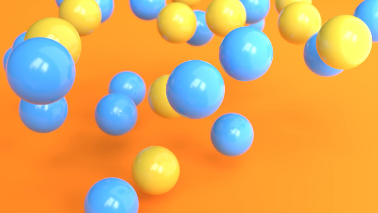 Yellow and blue bouncing balls on bright orange background.