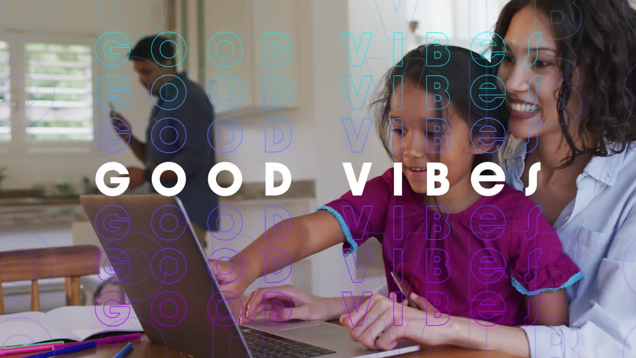 Animation of good vibes text over smiling biracial family using laptop